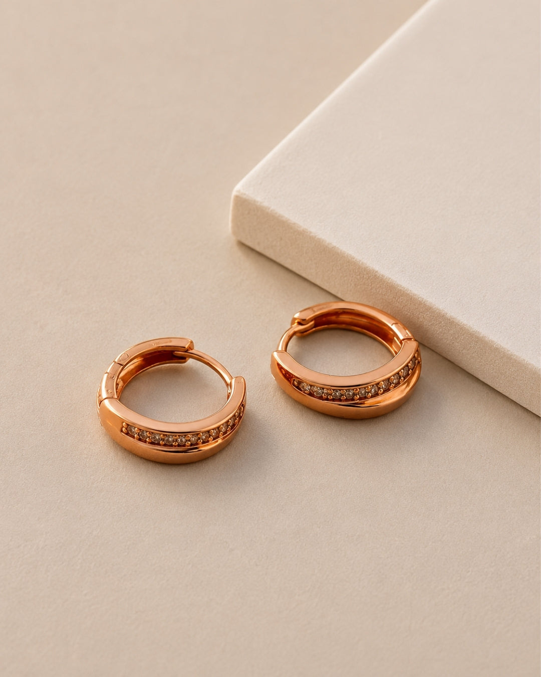 Rosé Gleam Huggie Hoop Earrings
