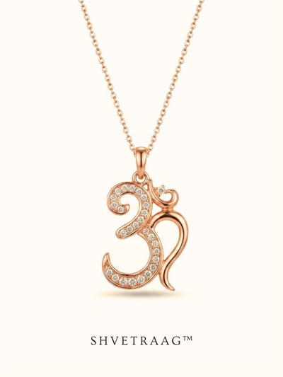 Divine Om rose gold pendant with sparkling white stones displayed on a velvet jewelry box.